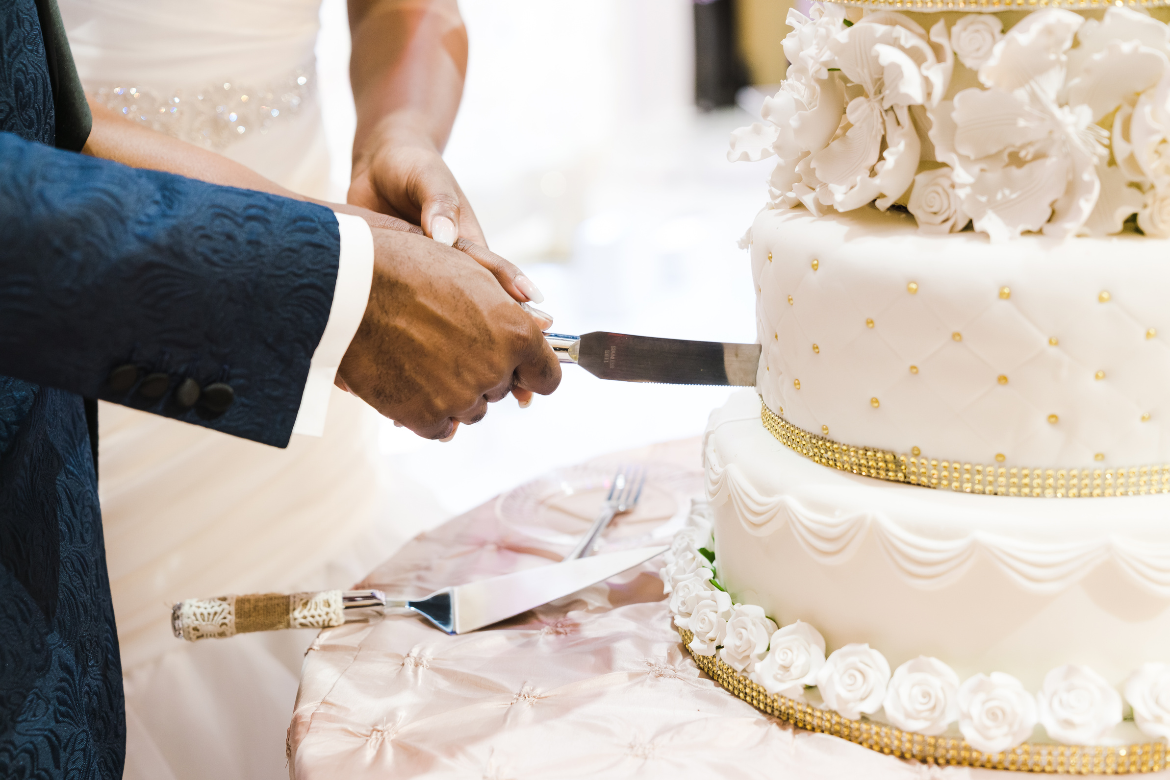 Newlyweds Slicing Wedding Cake